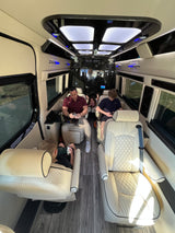 Family enjoys a spacious, modern RV rental interior, complete with comfy seats & entertainment.