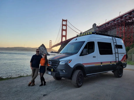Adventure awaits! Couple & their Storyteller Overland RV rental at the Golden Gate Bridge. Perfect for van life travel.
