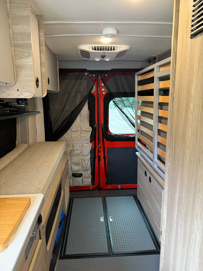  and flexible seating areas.|RV rental interior featuring a compact kitchen with sink — photo 9