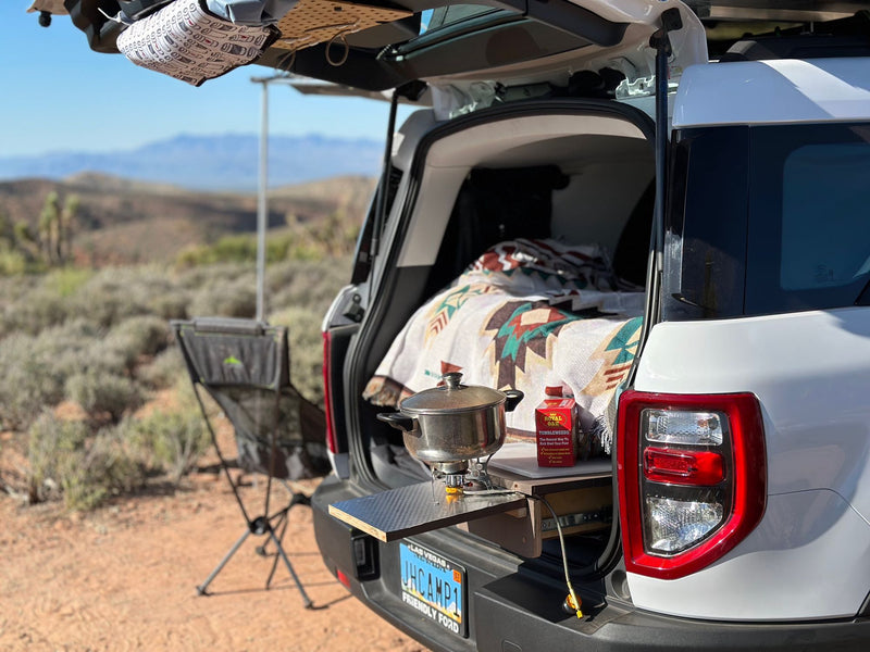  & gear for comfortable road trips.|Scenic RV rental camping setup with awning — photo 17