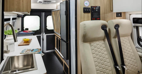 Inside a modern RV rental: a compact kitchen, bed area, and passenger seating with generator controls. Ready for travel.