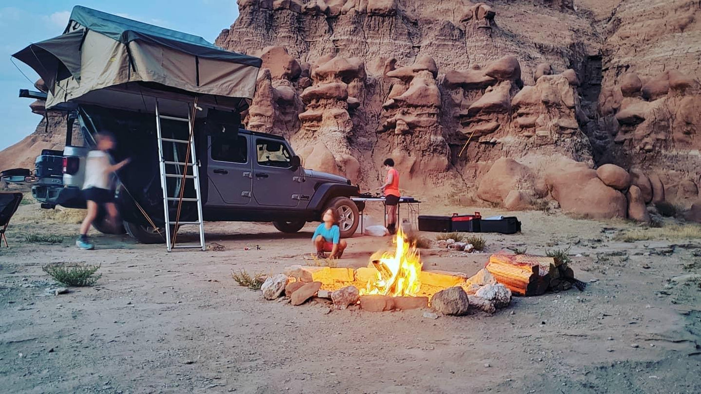 Desert camping with a rooftop tent on a Jeep & campfire. A unique outdoor escape, an alternative to an RV rental.
