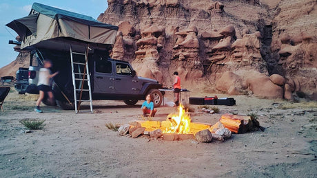Desert camping with a rooftop tent on a Jeep & campfire. A unique outdoor escape, an alternative to an RV rental.
