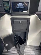 RV rental interior showing a Pioneer infotainment screen warning, control panel, and handy pull-out trash bin storage.