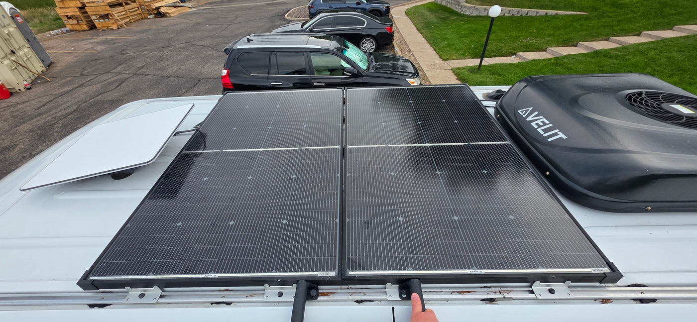 This RV rental features rooftop solar panels, a Starlink dish, and an AVELIT air conditioner for off-grid power and comfort. — photo 18