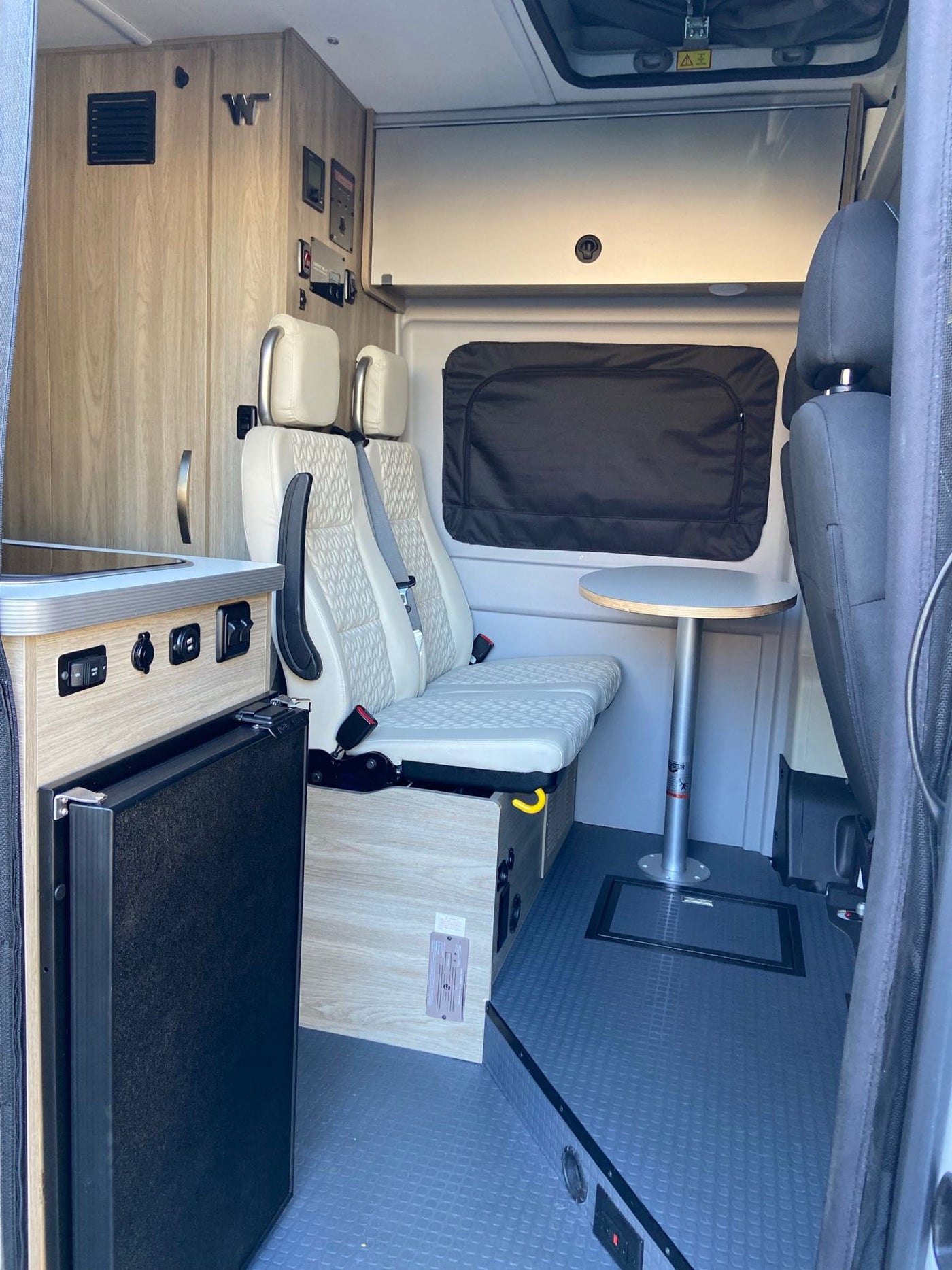  and pop-top access.|RV rental interior from driver's seat — photo 2