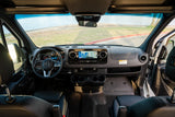 Spacious RV rental driver's cockpit with modern dash, infotainment screen, and hand controls for an accessible road trip.