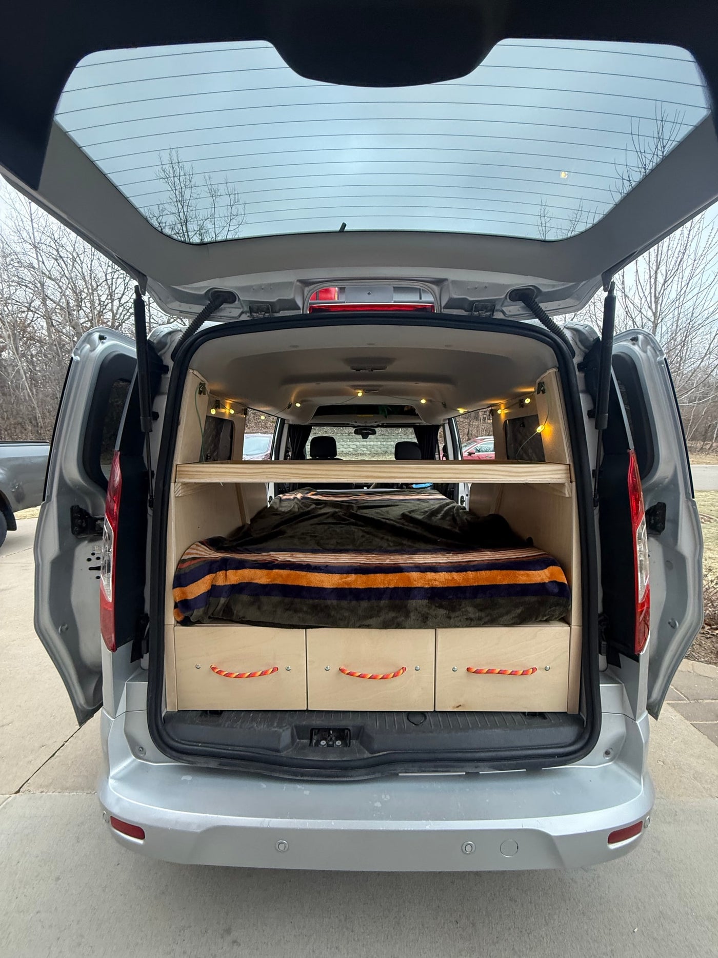  ideal for adventures.|An RV rental van with a roof box — photo 3