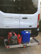 Ford Transit RV rental: rear cargo carrier with Honda generator, water, & fuel cans for off-grid power.