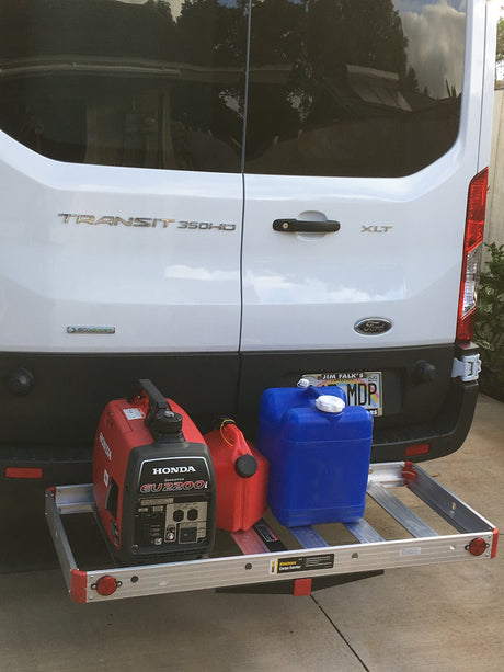 Ford Transit RV rental: rear cargo carrier with Honda generator, water, & fuel cans for off-grid power.