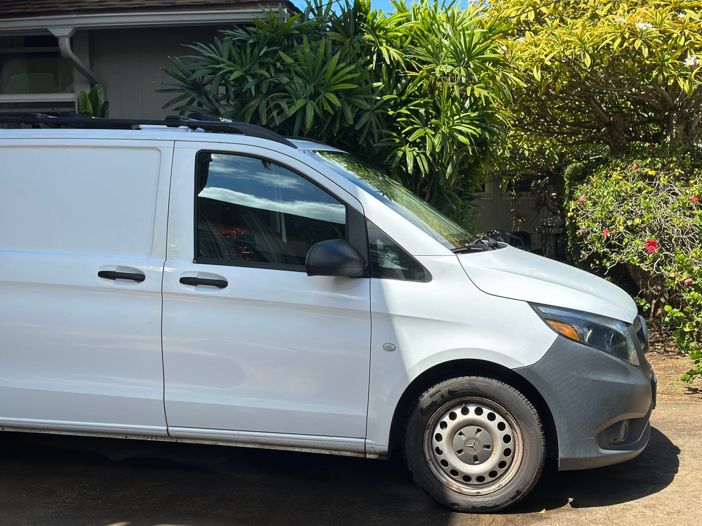 White Mercedes-Benz cargo van, suitable for an RV rental or campervan adventure, with roof racks. — photo 2