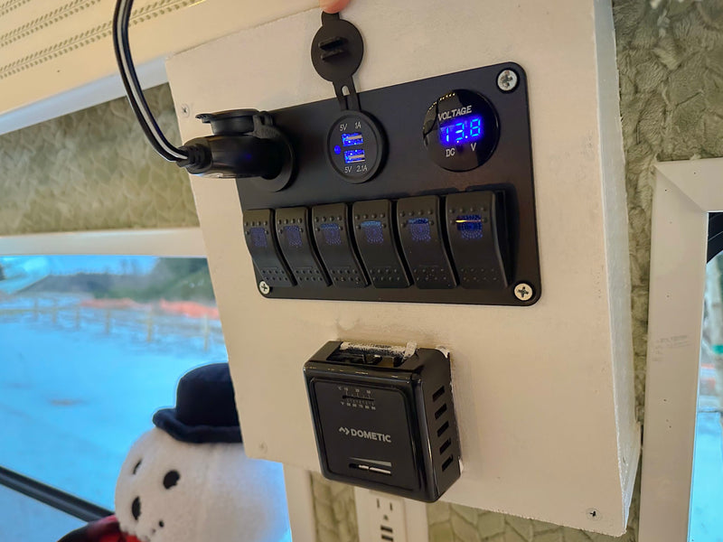  and a table. Perfect for a holiday getaway!|Experience cozy winter travels in this festive RV rental. Bright interior with snowflake lights — photo 14