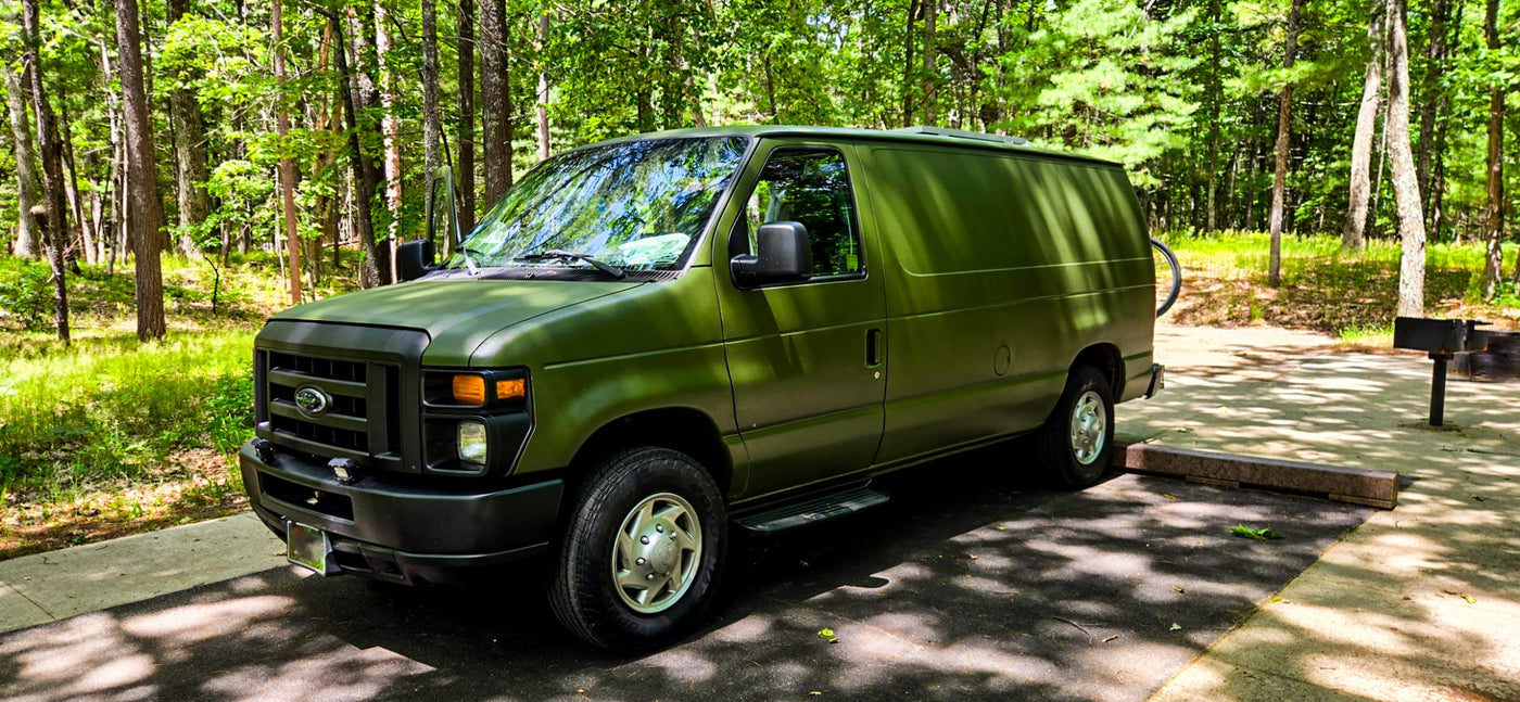 Olive green Ford E-Series van