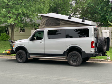  is an ideal RV rental for adventure.|This custom Nissan NV camper van with pop-top tent