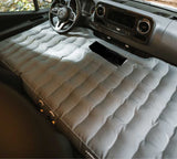 Perfect for an rv rental adventure: a comfortable inflatable mattress converts the front of this vehicle into a spacious car camping bed.