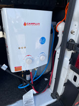 RV rental featuring a CAMPLUX portable tankless water heater and shower setup for convenient outdoor hot water.