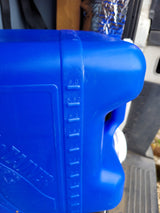 Close-up of a blue portable water tank, showing gallon measurements for an RV rental.