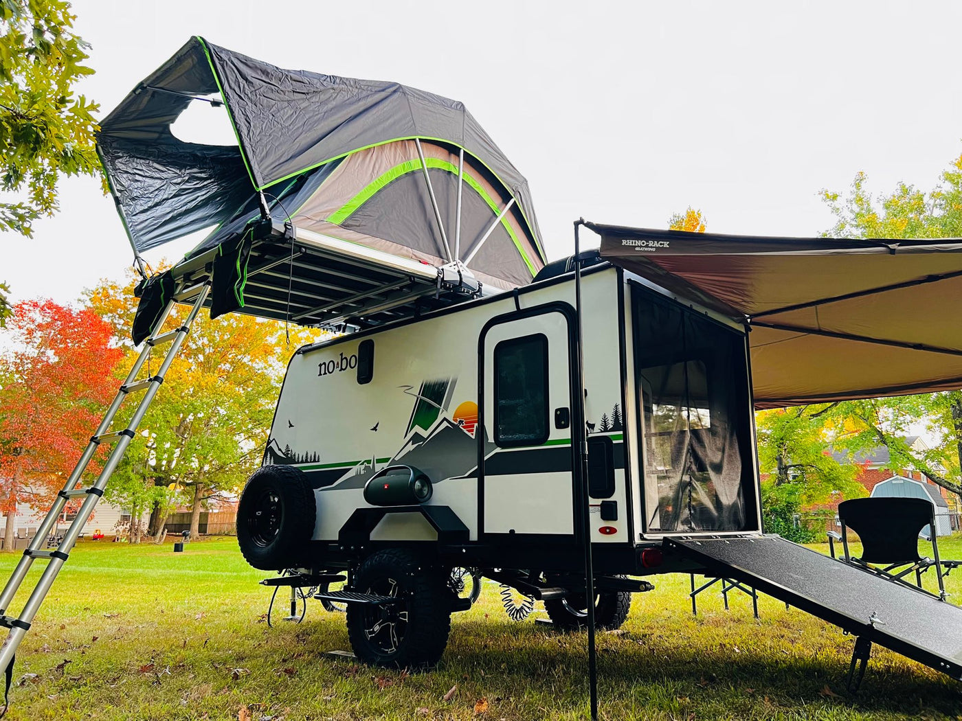  and e-bike ready for camping.|RV rental: A "no bo" camper trailer with a rooftop tent — photo 3