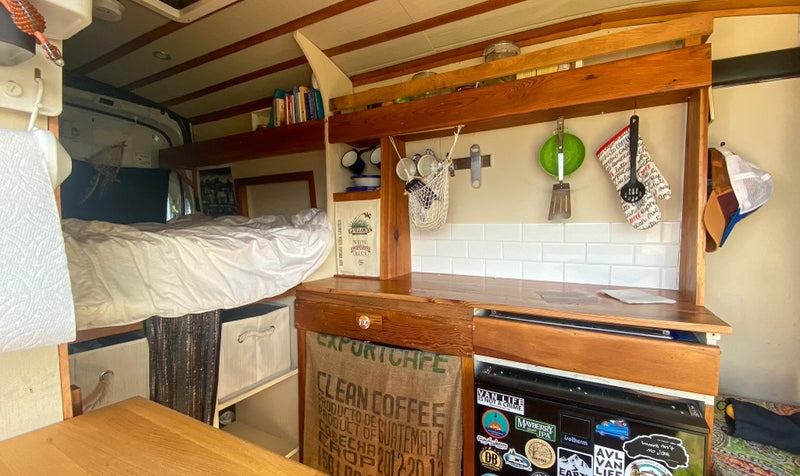  and a personalized fridge.|Experience van life in this rv rental! Cozy interior with kitchen — photo 7