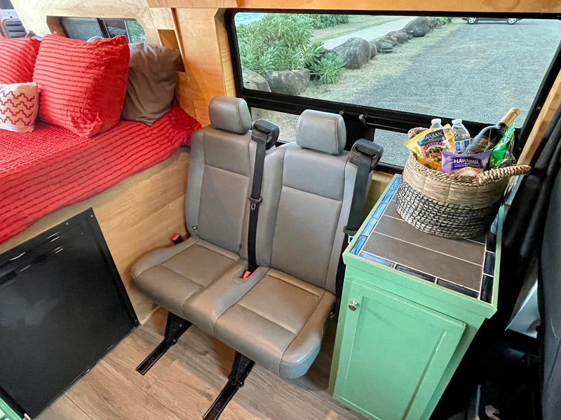  and safety equipment.|White rv rental camper van at a tropical beach sunset — photo 20