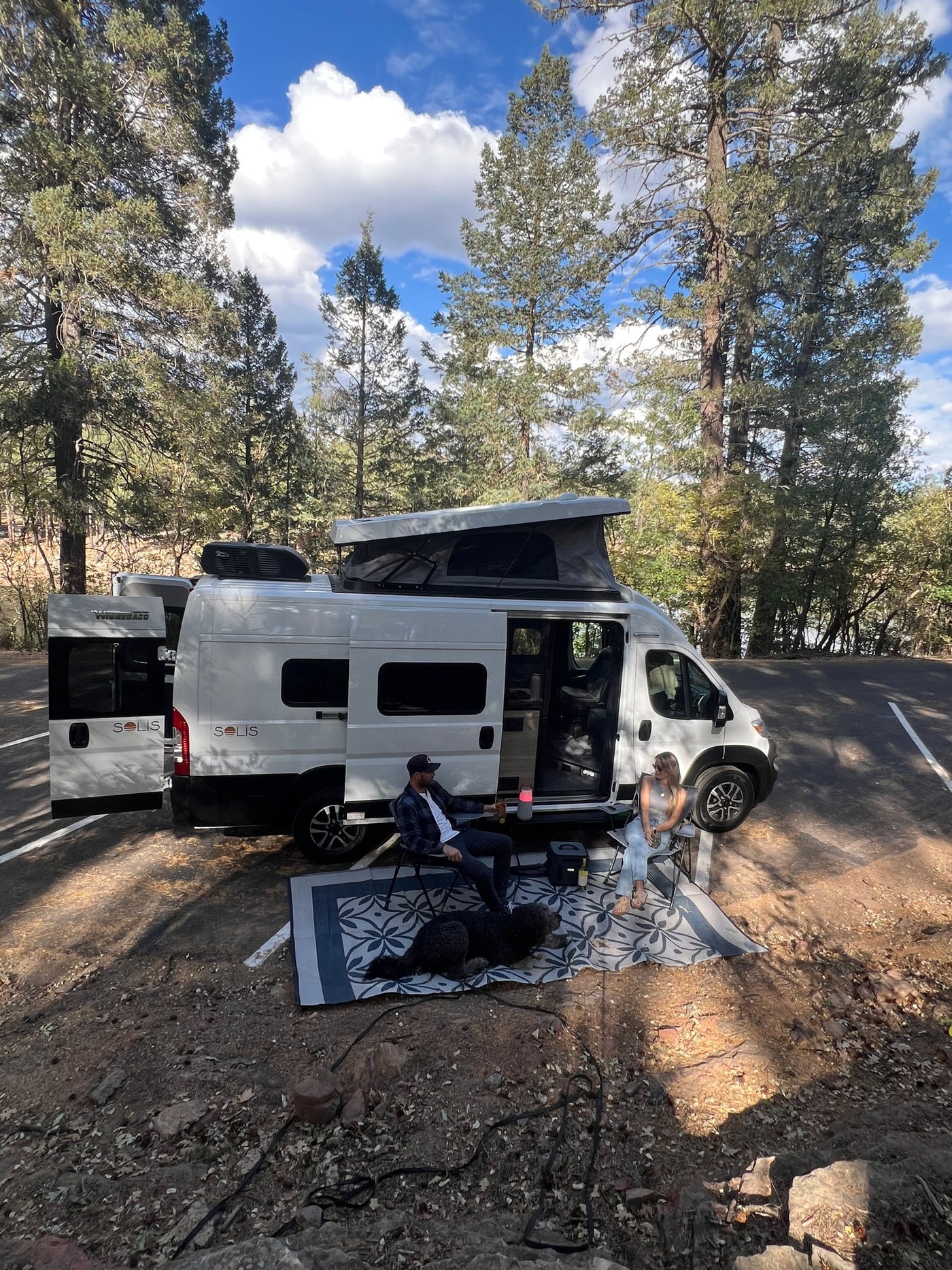 ready for adventure.|This RV rental camper van is perfectly set up for lakeside camping amidst tall pines — photo 8