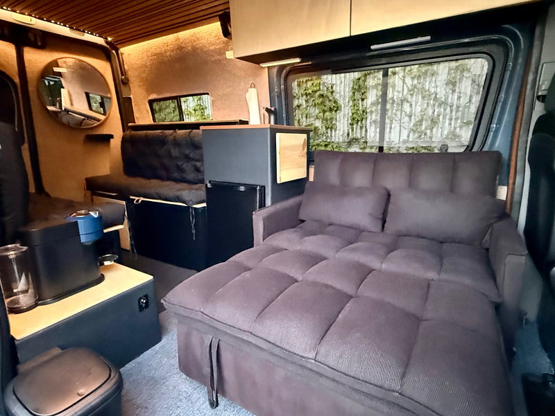  and rear ladder for adventures.|Sunset glow on an RV rental camper van with open door — photo 7