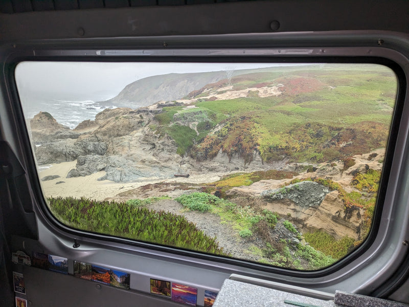  ready for adventure.|Scenic RV rental: Silver camper van by the ocean at sunset — photo 9