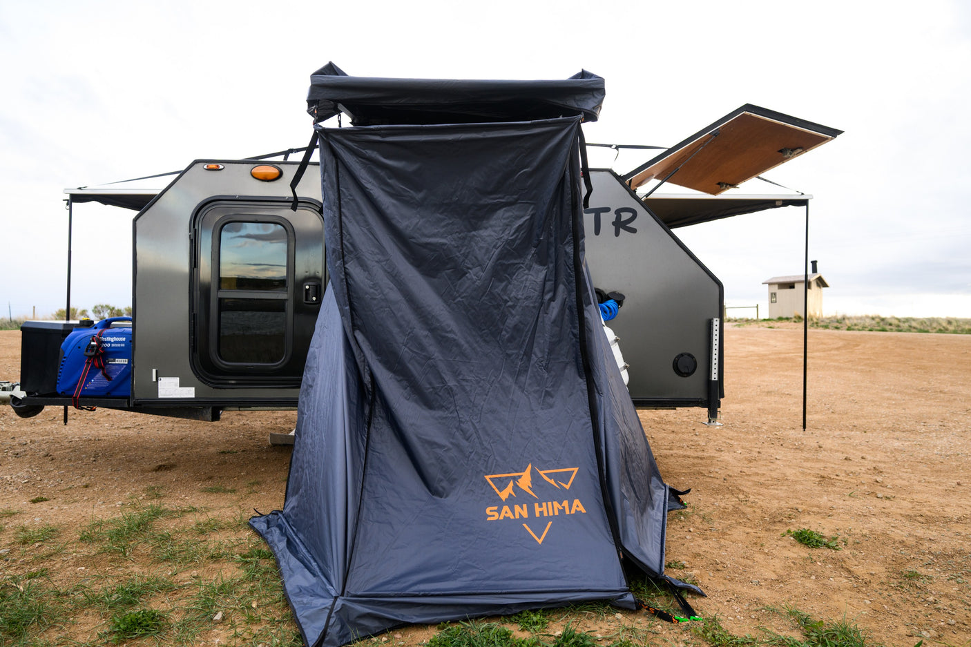 Mobile RV rental with San Hima privacy tent & generator for off-grid camping and outdoor adventures.
