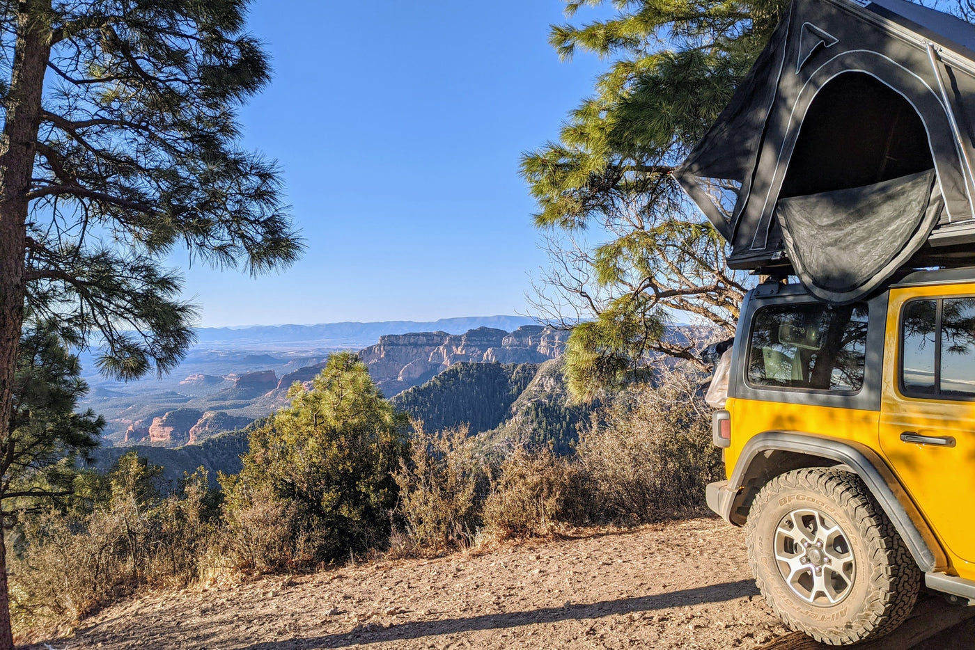 Yellow Jeep Rubicon with a rooftop tent at sunset. Ideal rv rental for scenic overlanding and camping.|Bright yellow Jeep Rubicon with rooftop tent on a dirt road. Explore off-road camping with this adventure RV rental.|Yellow Jeep Wrangler with an open rooftop tent — photo 20