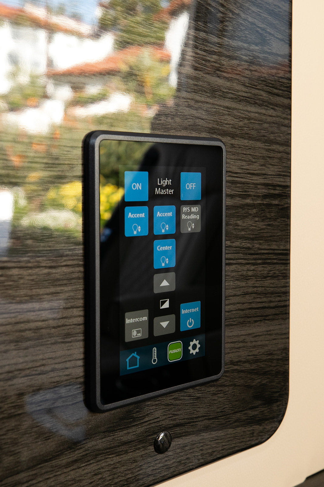 An RV rental smart control panel: This digital touchscreen manages lighting, internet, intercom, and climate for comfort.