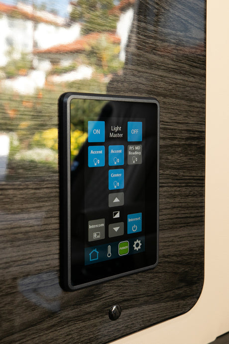 An RV rental smart control panel: This digital touchscreen manages lighting, internet, intercom, and climate for comfort.