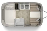 RV rental floor plan: An overhead view of a compact travel trailer interior with bed, kitchen, wet bath, and dinette.
