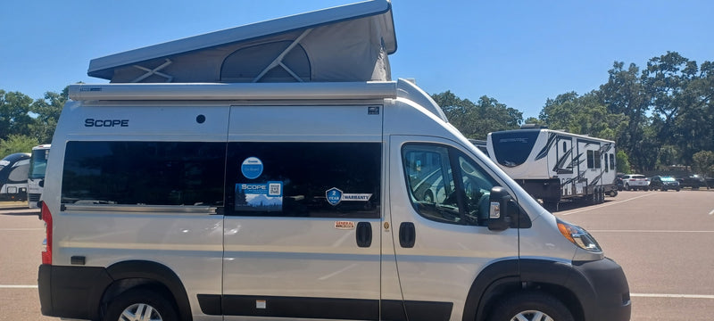  and a rolling side door.|Inside an RV rental: front driver & passenger seats — photo 18