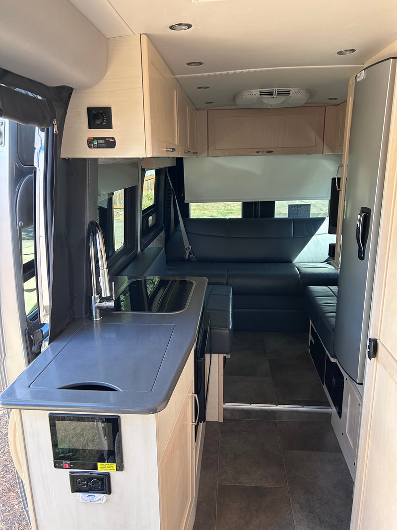  and overhead cabinets.|Compact RV rental bathroom interior — photo 6