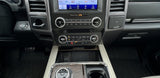 Car interior dashboard, showing infotainment, climate, USBs, and wireless charging. Great for an RV rental experience.