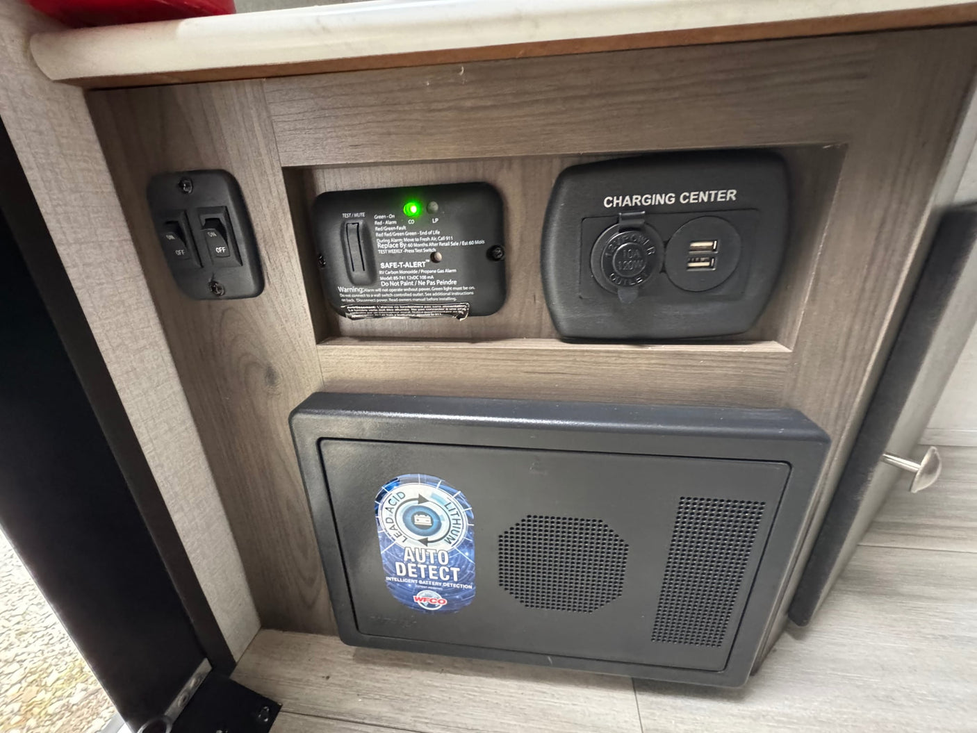  beside a Ford Bronco. Ready for camping.|Inside a compact RV rental: bed