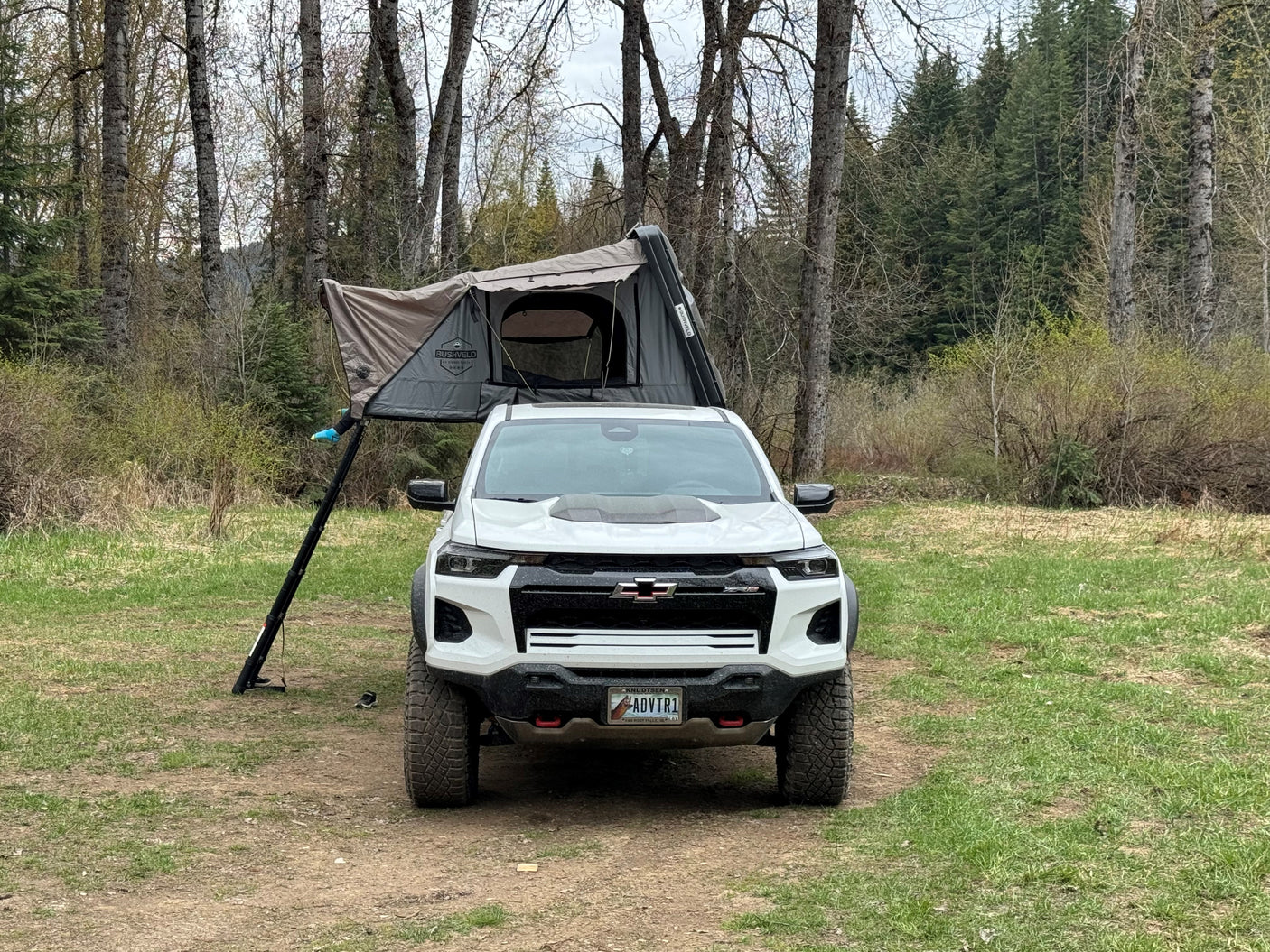 White Chevy Colorado with a Bushveld rooftop tent, perfect for camping. An exciting alternative to an RV rental.