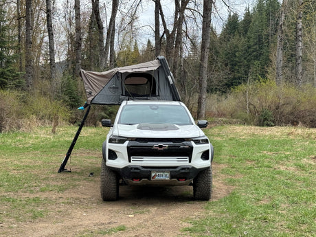 White Chevy Colorado with a Bushveld rooftop tent, perfect for camping. An exciting alternative to an RV rental.