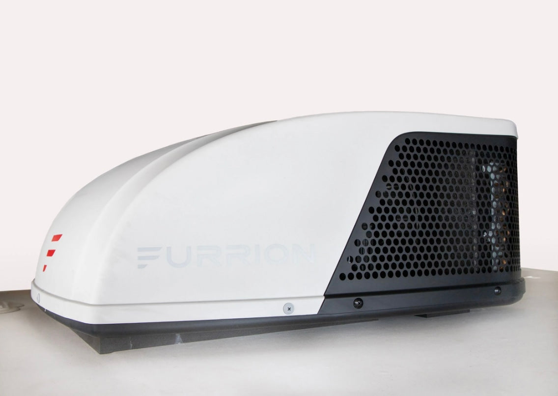 This white Furrion RV rooftop AC unit is vital for cool climate control in your rv rental, providing essential comfort.