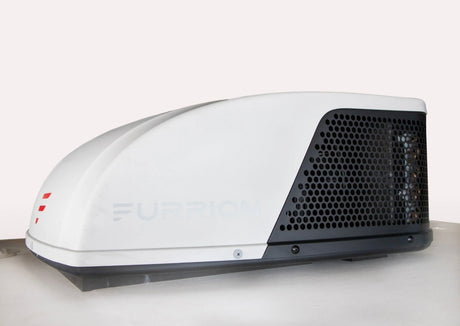 This white Furrion RV rooftop AC unit is vital for cool climate control in your rv rental, providing essential comfort.