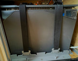 A dark gray EcoFlow 2KWH LFP battery secured with black straps. Ideal for off-grid RV rental adventures & portable power needs.