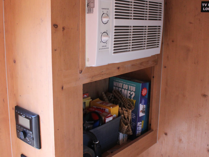  and a comfortable red bench leading to the open door.|Inside a cozy rv rental: wooden interior — photo 5
