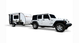 White Jeep Wrangler towing a Rove Lite teardrop camper, an RV rental perfect for camping adventures.