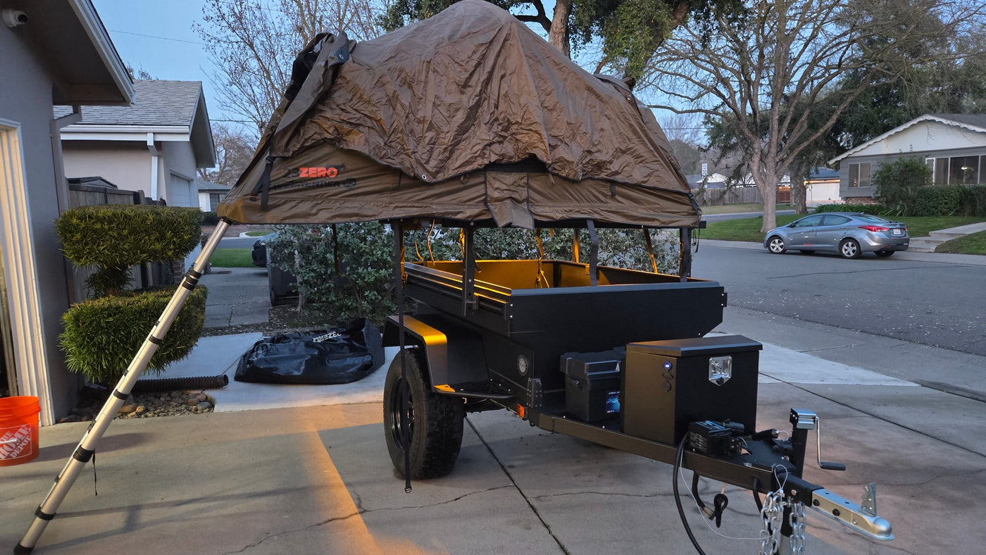 This overland trailer with a rooftop tent is perfect for camping adventures, offering a compact RV rental alternative. — photo 3