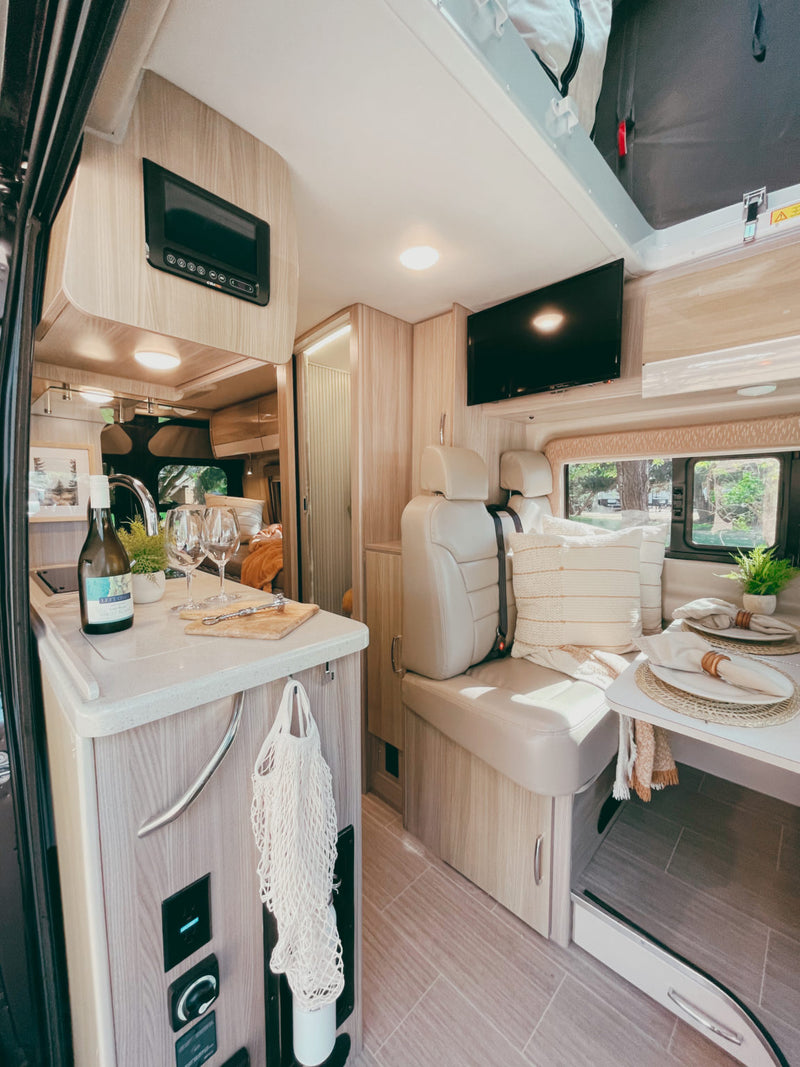  pans) & comfortable bed. Perfect for travel!|Step inside this cozy RV rental camper van! Featuring a kitchen — photo 12