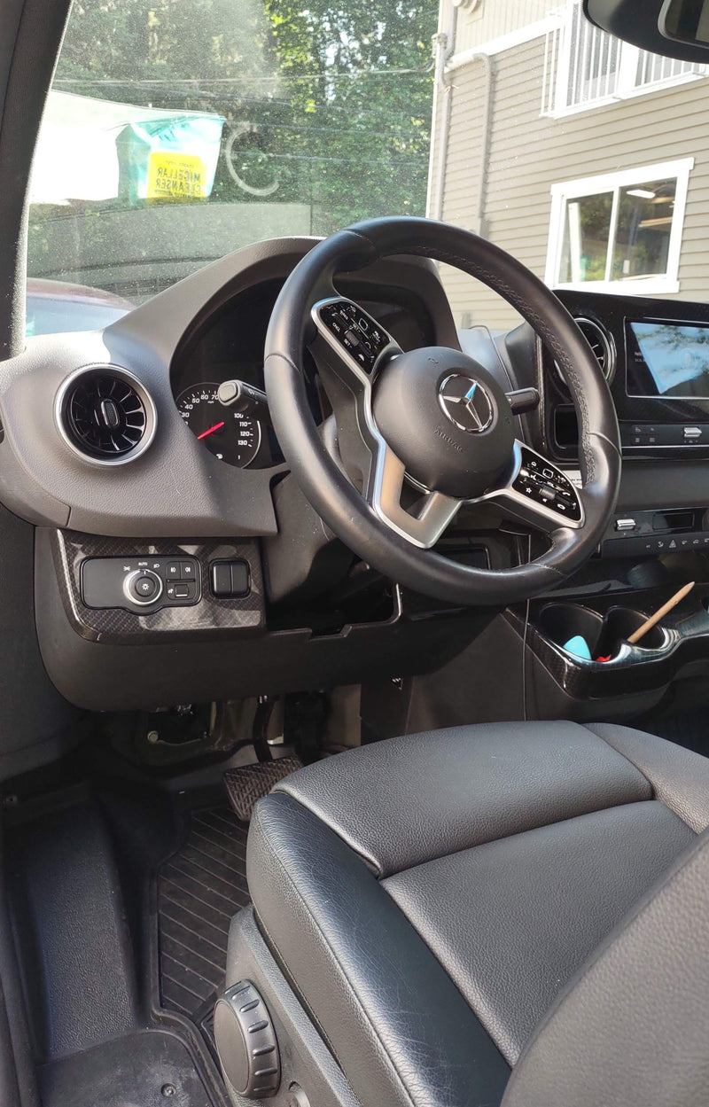 Interior of a Mercedes-Benz Sprinter van, often used for RV rentals. Shows driver's seat, steering wheel, & dashboard. — photo 5