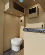 Beige RV rental wet bath with compact toilet, counter, and overhead storage for efficient travel.
