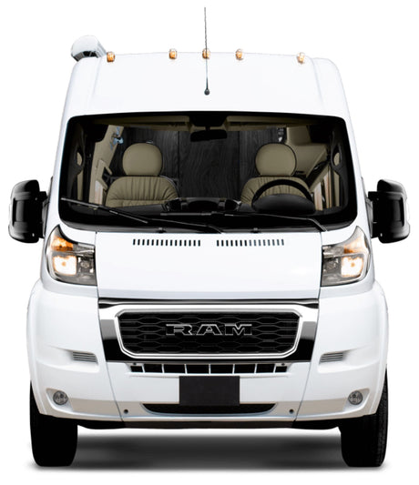 Frontal view of a white Ram ProMaster camper van, ready for an rv rental.