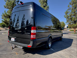 Black Mercedes Sprinter van, shining in the sun, perfect for your next RV rental adventure or camper travel.