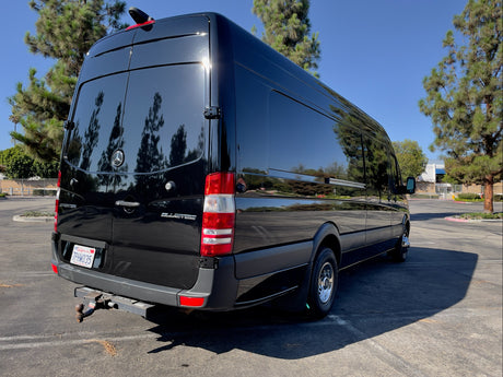 Black Mercedes Sprinter van, shining in the sun, perfect for your next RV rental adventure or camper travel.